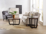 Hooker Furniture Parkcrest Round End Table, a wooden side table with a circular top and modern black metal legs, placed in a stylish living room setting.