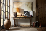 Hooker Furniture Bluewind Flip-Top Console Table, a rustic wooden console table with turned legs, positioned against a wall with decorative items and artwork, in a cozy home interior.