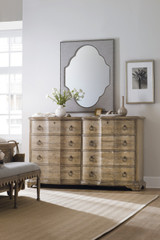 Hooker Furniture Bluewind Flip-Top Console Table, rustic wooden sideboard with multiple drawers and decorative ring pulls in a bright living space.