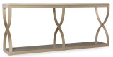 Hooker Furniture Elixir Console Table, elegant beige-colored furniture piece with curved base design and lower shelf for versatile home decor.