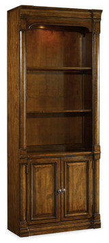Hooker Furniture Tynecastle Bunching Bookcase, a tall wooden bookcase with open shelves and closed cabinet doors at the bottom, made of polished rich brown wood.