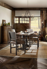 Hooker Furniture Balcones 60-inch Friendship Table with 2-12 inch Leaves, rustic wood dining table set in a cozy farmhouse style dining room with natural light.