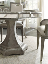 Hooker Furniture Sanctuary Rectangle Dining Table with 2-20 inch leaves, shown in a light wood finish, with dining chairs and elegant glassware set for a stylish dining room.