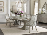 Hooker Furniture Sanctuary Rectangle Dining Table with 2-20 inch leaves, in a sophisticated dining room setting with elegant chairs, chandelier, and decorative accents.