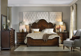 Hooker Furniture Leesburg California King Poster Bed, traditional wooden bed with tufted white headboard in a bedroom setting.