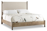 Hooker Furniture Affinity King Upholstered Bed, beige fabric upholstered headboard with wooden frame and bird-themed bedding with branches and birds design.