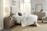 Hooker Furniture Affinity King Upholstered Bed, modern bedroom with light-colored upholstered bed, wooden nightstands, and decor.
