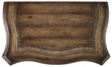 Hooker Furniture Rhapsody Bachelors Chest, wooden surface with a curved design and a distressed finish.