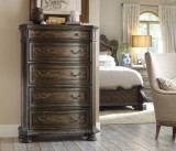 Hooker Furniture Rhapsody Five Drawer Chest, wooden dresser with five drawers and ornate metal handles in a bedroom setting.