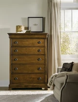 Hooker Furniture Archivist Six-Drawer Chest, wooden bedroom dresser with six drawers and round black knobs in a cozy, well-lit room.
