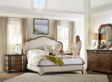 Hooker Furniture Archivist Bachelors Chest, elegant bedroom interior with wooden dresser, upholstered bed, and cozy decor.