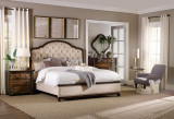 Hooker Furniture Sanctuary Mariette Lounge Chair, elegant upholstered lounge chair with a tufted backrest in a stylish bedroom setting.