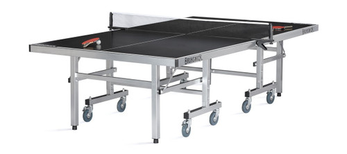 Brunswick Billiards Brunswick Smash 7.0 Indoor/Outdoor Table Tennis Table, black and silver with a net, paddles, and balls on the surface.