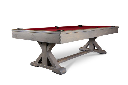 Doc & Holliday Hepburn Slate Pool Table, stylish billiards table with a red felt surface and wooden frame on a rustic wooden stand.