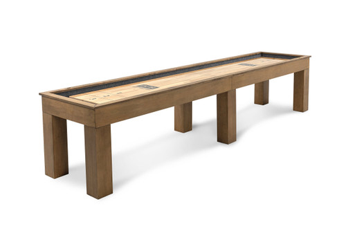 Angled studio view of the Paula Parsons shuffleboard table by Doc & Holliday in glazed maple, highlighting the depth of the solid maple frame and the recessed scoring along the butcher block playfield

