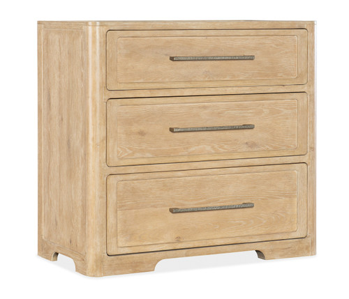 Hooker Furniture Retreat Three-Drawer Nightstand, light wood finish wooden nightstand with three drawers and metal handles.
