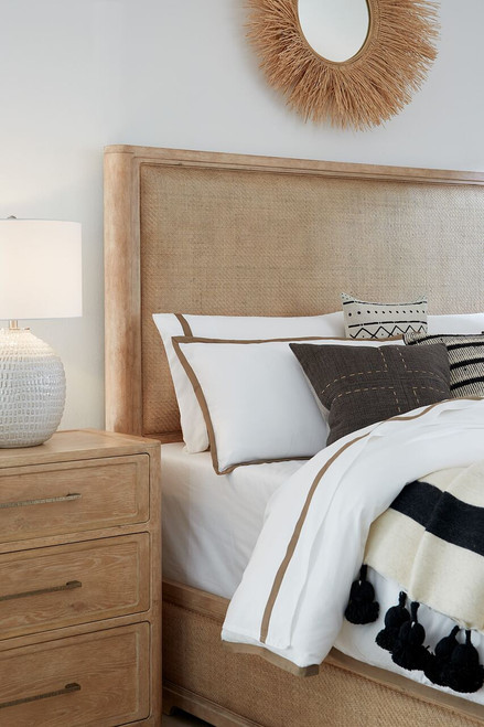 Hooker Furniture Retreat California King Cane Panel Bed, elegant bedroom setup with neutral tones, upholstered headboard, and coordinated bedding accessories.