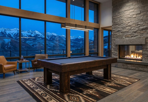 Doc & Holliday Maverick Rustic Slate Pool Table – Buffalo Nickel Rail Sights, in a modern game room with mountain view, large floor-to-ceiling windows, fireplace, and comfortable seating.
