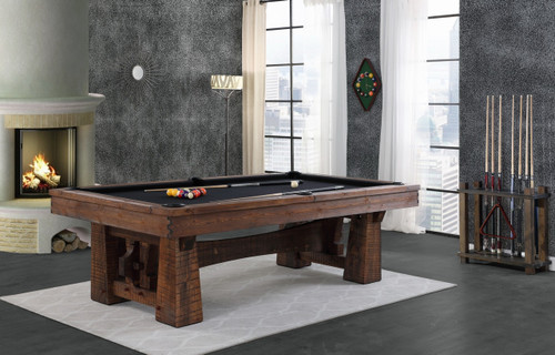 Playcraft BullRun 8' Slate Pool Table - Rustic Timber Frame, wooden pool table in a modern living room with large windows, fireplace, and pool cues rack.