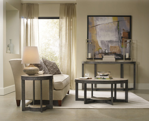 Hooker Furniture Mill Valley Round End Table, modern living room scene with round end table, lamp, sofa, and artwork.