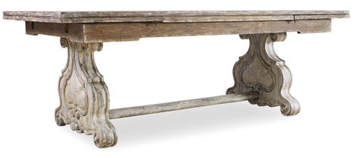 Hooker Furniture Chatelet Refectory Rectangle Trestle Dining Table with Two 22'' Leaves, showcasing a rustic wooden table with ornate trestle-style legs and two expandable leaves.