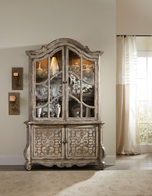 Hooker Furniture Chatelet Buffet, rustic wooden display cabinet with glass doors and intricate carved details.