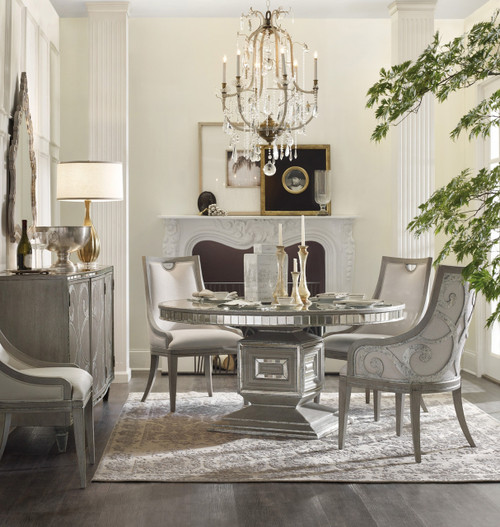 Hooker Furniture Sanctuary Buffet, elegant dining room with a vintage-style white buffet, decorative bottles, and a lamp on top, in a luxurious interior setting.