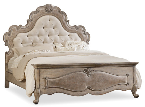 Hooker Furniture Chatelet Queen Upholstered Panel Bed, vintage-style bed with an ornate carved wooden frame and a tufted upholstered headboard in a neutral beige color.