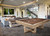 Brunswick Billiards Brunswick Matanza Slate Pool Table - Sandwash Finish, in a modern living room with comfortable seating, stone accents, and a staircase.