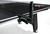 Brunswick Billiards CT7 Table Tennis Conversion Top, black table tennis top with net and paddle on a pool table.