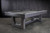 Doc & Holliday Everly Slate Pool Table, modern grey pool table with sleek design and clean lines on a concrete floor against a dark textured wall.