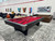 Brunswick Billiards Brunswick Black Wolf Slate Pool Table, modern and stylish pool table with red felt in a game room setting.