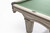 Brunswick Billiards Brunswick Glenwood Pool Table in Rustic Grey, close-up of the corner showing the green felt surface and wood finish.