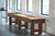 Brunswick Billiards Brunswick Canton Shuffleboard Table, 12 or 14 feet, in Black Forest Finish, placed in a modern room with white brick walls and large windows.