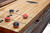 Brunswick Billiards Brunswick Canton Shuffleboard Table, 12' or 14' with Black Forest Finish, close-up of the surface with pucks and scoring system.