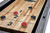 Brunswick Billiards Brunswick Sanibel Shuffleboard Table | Rustic Grey, close-up of shuffleboard playing surface with pucks and scoring zones.