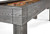 Brunswick Billiards Brunswick Sanibel Shuffleboard Table, rustic grey finish, close-up of wooden corner with shuffleboard pucks on playing surface.