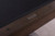 Plank & Hide Co Plank & Hide Voxwood 8' Pool Table, close-up of the smoke walnut wood finish with a metal plaque on the edge.