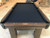 Plank & Hide Co Elias Slate Pool Table with Storage Drawer, top view showing the black felt surface and wooden frame.