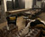 Plank & Hide Co Isaac Shuffleboard Table | Plank & Hide | Free Install, modern shuffleboard table in a cozy living room setting with wooden flooring and large windows.
