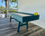 Venture Shuffleboard Mason Sport Shuffleboard Table by Venture, modern blue and white shuffleboard table situated indoors near large windows with a view of palm trees outside.