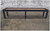 Venture Shuffleboard Buckhead Shuffleboard Table by Venture, made in USA, in an industrial setting with a brick wall and concrete floor.