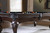 Playcraft Wheaton 8' Slate Pool Table, Briar Finish, with Play Kit, featuring a dark wood finish, black felt surface, and pool balls arranged on the table in a well-lit game room.