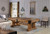 Playcraft Colorado Slate Pool Table | Saddle Finish | Kit, a rustic wooden pool table with a saddle finish set in a well-lit, elegant living room with wall-mounted cue racks and decorative wall art.