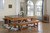 Playcraft Willow Bend Slate Pool Table with Dining Top Option and Free Play Kit, in a well-lit game room with large arched windows, wooden floors, and decor including a ball and cue rack, a flower vase, and a pool ball display.
