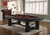 Playcraft Rio Grande Slate Pool Table, weathered Raven finish, with red felt surface, billiard balls, and pool cues, situated in a well-lit game room.