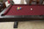 Playcraft Brazos River 8' Slate Pool Table, Weathered Black Finish, showing a red felt surface with pool balls racked and a cue ball ready for play.