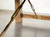 Isaac Pool Table in a Stressed Brulee Brown finish. Featuring brished golden metal turnbuckles. Isaac Pool Table in a Stressed Brulee Brown finish. Featuring brished golden metal turnbuckles.
