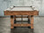 Isaac Pool Table in a Stressed Brulee Brown finish. Featuring brished golden metal turnbuckles. Isaac Pool Table in a Stressed Brulee Brown finish. Featuring brished golden metal turnbuckles.