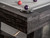 Plank & Hide Co Isaac Pool Table Distressed Black & Gold, close-up of the corner showing the black wood finish and Gold accents with billiard balls on the table surface.